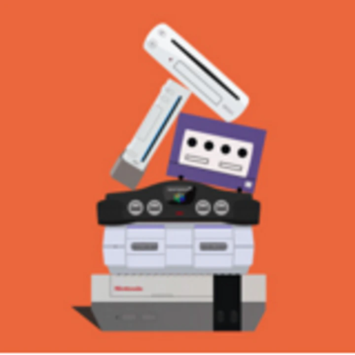 Stack of retro computers and music equipment on orange